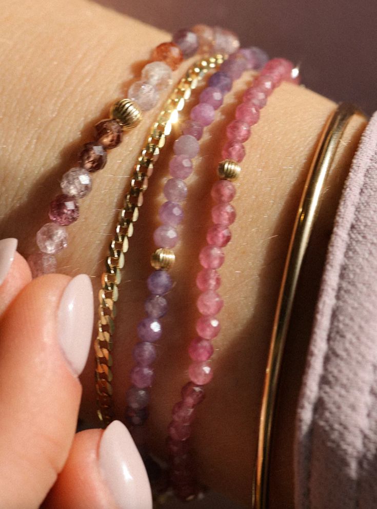 Named for how well these play (and stack) with others, these gemstone stretchy bracelets are handmade in Vancouver. Pink Tourmaline Bracelet: 3mm beads, 3mm 14k gold-filled bead detail Purple Sapphire Bracelet: 3mm beads, 3mm 14k gold-filled bead detail Spinel Bracelet: 4mm beads, 4mm 14k gold-filled bead detail Details Each piece of Leah Alexandra jewellery is handmade in her Vancouver beachside studio. Only the finest materials are used, including 14k gold fill, sterling silver, and carefully Dainty Purple Beaded Bracelets With Round Beads, Everyday Stackable Rondelle Beaded Bracelets, Delicate Faceted Beaded Bracelets For Everyday, Dainty Stackable Beaded Bracelets For Layering, Dainty Stackable Rondelle Bracelets, Everyday 14k Gold Filled Gemstone Beads Bracelets, Everyday 14k Gold Filled Bracelets With Gemstone Beads, Dainty Stackable Rondelle Beaded Bracelets, Elegant Pink Stretch Bracelet For Everyday