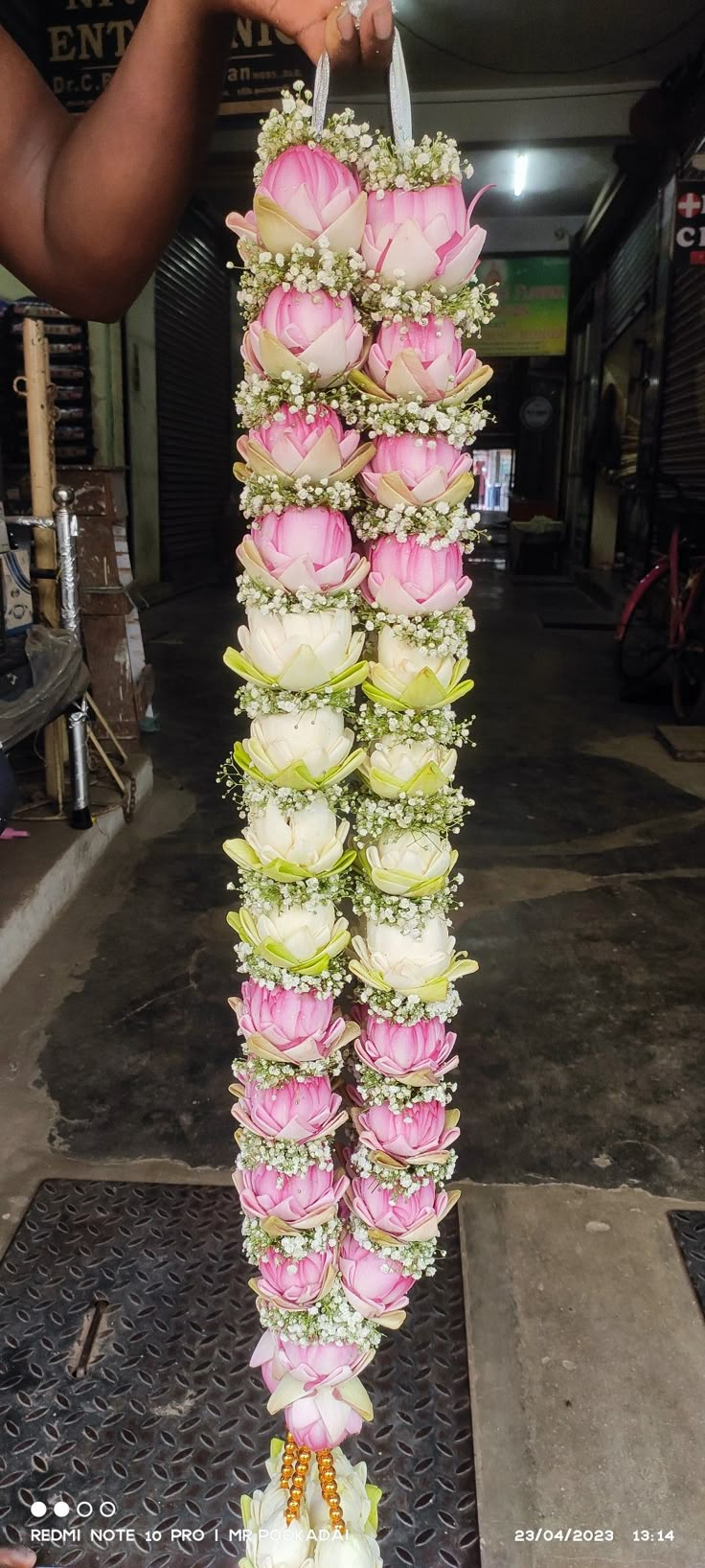 a person holding a bunch of flowers in their hand