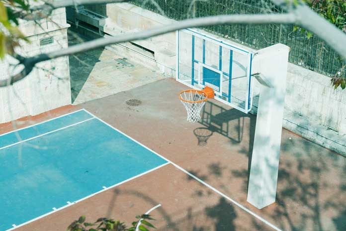 an aerial view of a basketball court and hoop