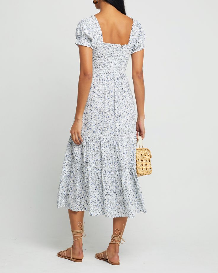 Price Comparison Few Moda $59 Reformation $398 GANNI $295 Product Details This easy-tiered maxi dress has a smocked bodice and short puff sleeves. Done in a cotton blend for a light and airy feel.- Pockets- Puff sleeves- Content: 70% Polyester, 21% Viscose, 9% Spandex Style# T20WDR10135 Fit Notes - Model wearing a size XS- Model measurements: 5'9'' Height / 32'' Bust / 25'' Waist / 35'' Hips Short Sleeve Ruched Smocked Dress For Garden Party, Ruched Short Sleeve Smocked Dress For Garden Party, Summer Puff Sleeve Maxi Dress With Smocked Bodice, Short Sleeve Midi Dress With Smocked Bodice, Short Sleeve Smocked Dress For Brunch, Summer Smocked Flowy Dress With Puff Sleeves, Breezy Maxi Dress With Smocked Bodice For Day Out, Summer Flowy Smocked Dress With Puff Sleeves, Cotton Smocked Dress For Garden Party With Short Sleeves