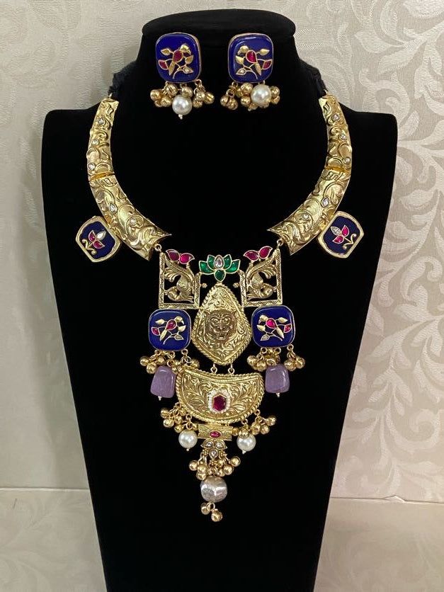 Indulge in the beauty and tradition of this Antique Gold Finish Meenakari Designer Hasli Necklace Set for women. Its elegant and intricate design showcases the finest craftsmanship and adds a touch of sophistication to your outfit. Perfect for any occasion, this necklace set is a must-have for any fashion-forward woman. Traditional Meenakari Pendant Necklace, Luxury Meenakari Necklaces For Festivals, Luxury Meenakari Necklace For Festivals, Luxury Meenakari Necklaces, Luxury Spiritual Meenakari Necklace, Hasli Necklace, Goddess Dress, Kundan Earrings, Finger Rings