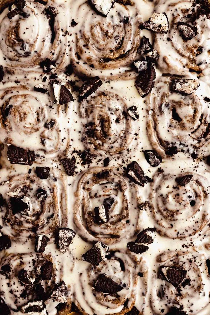 a close up of a pie with icing and chocolate chips