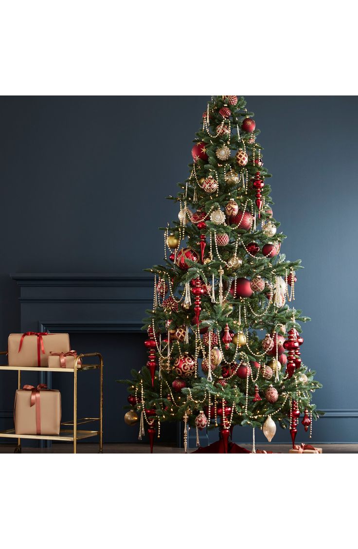 a decorated christmas tree with presents under it