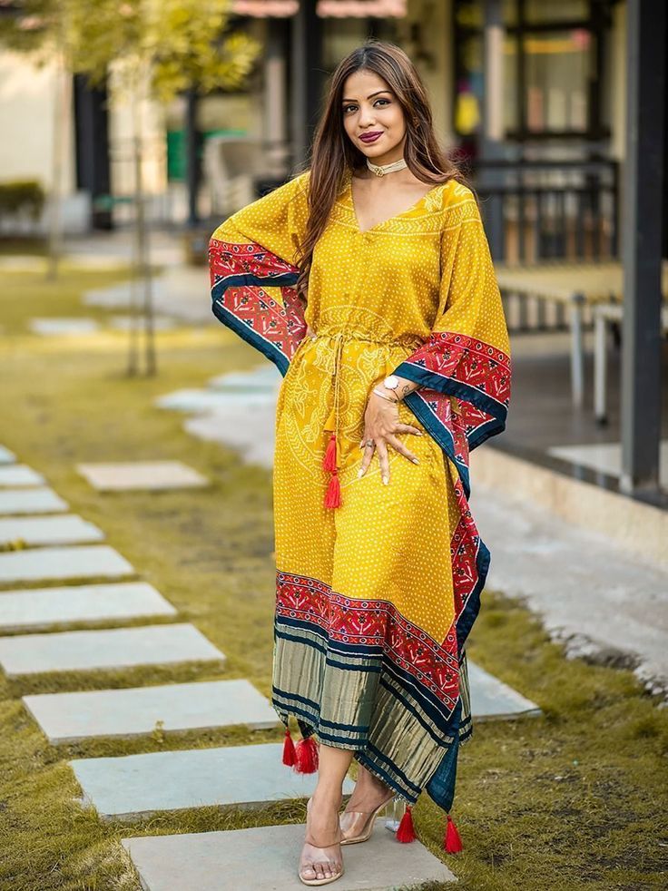 <ul>
<li style="text-align: justify;"><span data-preserver-spaces="true"> Try out some ethnic touch kaftan kurti made with gaji silk and digitally printed in bandhani and patola border with gajji silk golden patta also embellished with gotta patti lace and waist drawcord with tessel.</span></li>
<li style="text-align: justify;"><span data-preserver-spaces="true">This feautured yellow kaftaan is ready to wear free size " (Customer can adjust up to 44 Kaftan Dress Modern, Patola Border, Kaftan Kurti, Kaftan Style Dresses, Bandhani Dress, Kaftan Designs, Lehenga Blouse Designs, Gotta Patti, Kaftan Style