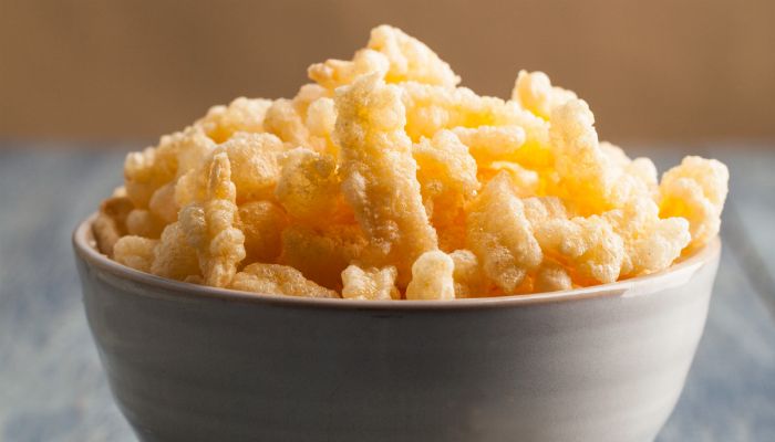 a bowl filled with fried food on top of a table