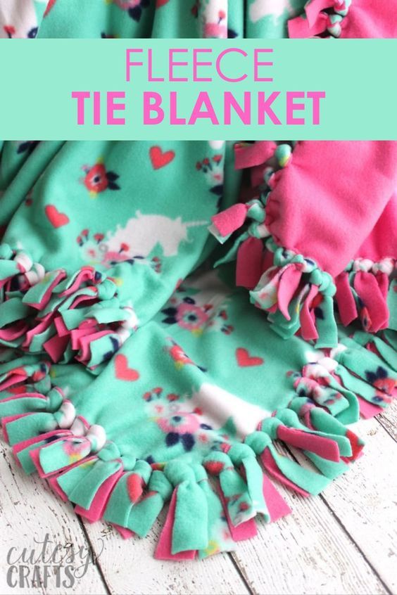 a blanket with ruffles on it and the words fleeie tie blanket over it