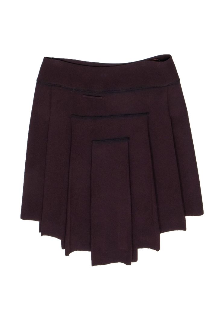 Treat yourself to this Jean Paul Gaultier pleated skirt and make a fashion statement! With an edgy asymmetrical hem and maroon hue that's sure to turn heads. Pair this one-of-a-kind find with a silk blouse and a classic pump! Size 10 Made in Italy 70% Triacetate, 30% Polyester Invisible side zipper Unlined Pleated detail Waist 34.25" Hips 38.25" Length (from upper waist side seam to lower side seam) 22.25" Fitted Pleated Skirt With Asymmetrical Hem, Fitted Pleated Asymmetrical Skort, Pleated Asymmetrical Fitted Mini Skirt, Fitted Pleated Asymmetrical Mini Skirt, Fitted Asymmetrical Pleated Mini Skirt, Fitted Asymmetrical Skort For Fall, Fitted Burgundy Pleated Skirt, Fitted Lined Burgundy Mini Skirt, Fitted Burgundy Lined Mini Skirt