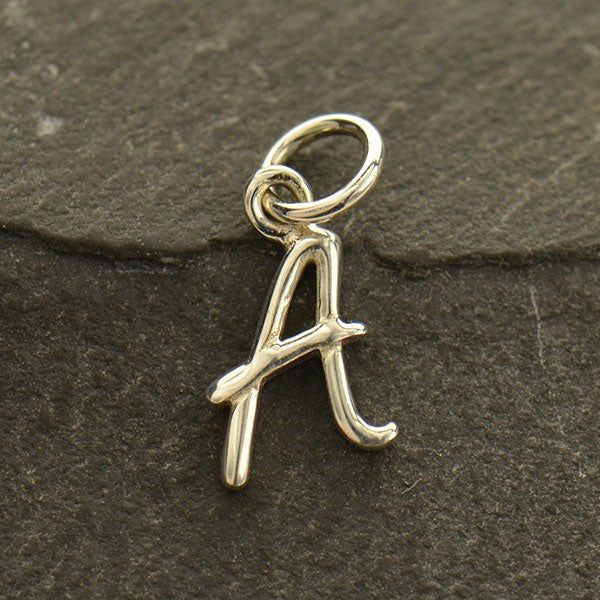 Create your own personal jewelry with these Sterling Silver Initial Charms. String this initial charm onto a Finished Chain for an elegant charm necklace or create a cluster necklace with birthstone charms or sports charms! Measurements approximately: 10mm x 6mm x 1mm Make Your Own Necklace, Silver Initial Charms, Fancy Hands, Alphabet Charm, Sweet Necklace, Sterling Silver Initial, Letter Charm, Silver Bead Bracelet, Monogram Jewelry