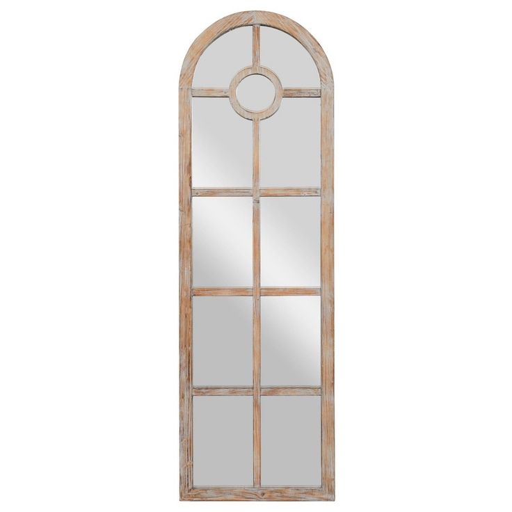 an arched window with mirrors on the sides and a mirror in the middle, against a white background