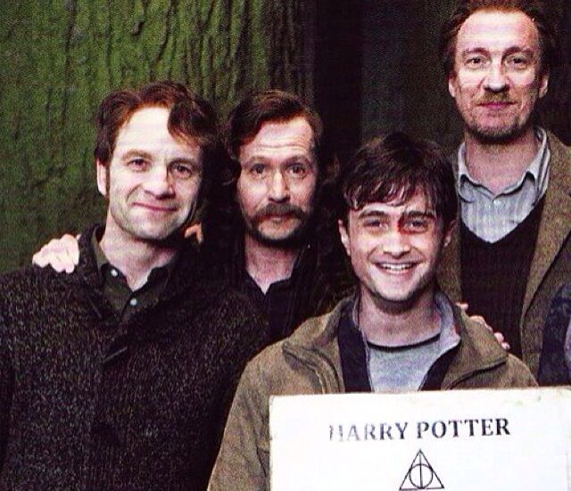 the harry potters are posing for a photo with their prize sign in front of them