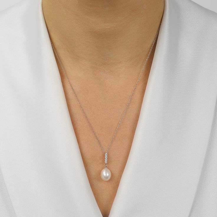 Brilliant in every way, this heart-shaped Pearl pendant pearl necklace is an accessory that exudes luxury and refinement. Shop Matching Earrings Elegant Bridal Necklace With Pearl Chain For Anniversary, Elegant Teardrop Pendant Pearl Necklace, Elegant Bridal Necklace With Pearl Pendant For Anniversary, Elegant Sterling Silver Pearl Necklace With Teardrop Pendant, Elegant Sterling Silver Teardrop Pendant Pearl Necklace, Elegant Teardrop Pearl Pendant Jewelry, Pearl Drop Necklaces For Anniversary, Elegant Teardrop Pendant Necklace In White Gold, Elegant Pearl Pendant Bridal Necklace