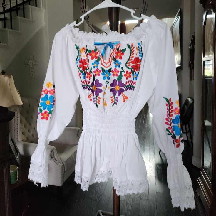 Embroidered Blouse White Embroidered Long Sleeve Top, White Long Sleeve Top With Embroidered Hem, White Long Sleeve Blouse With Embroidered Hem, Fitted Long Sleeve Top With Embroidered Hem, White Peasant Top For Festival, White Folk Tops With Embroidered Sleeves, White Folk Top With Embroidered Sleeves, White Long Sleeve Tops With Geometric Embroidery, White Cotton Peasant Top With Embroidered Sleeves