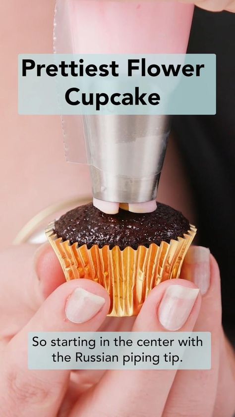 a woman holding a cupcake in her hand with the caption prettiest flower cupcake so starting in the center with the russian piping tip