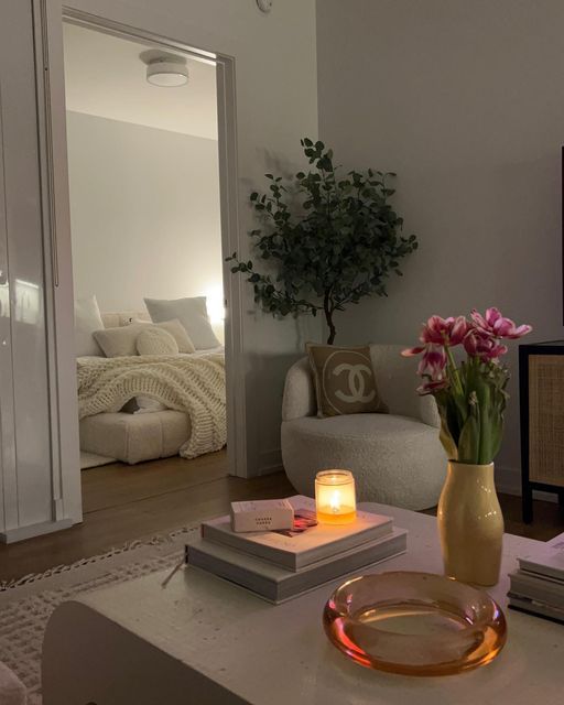 a living room filled with furniture and flowers