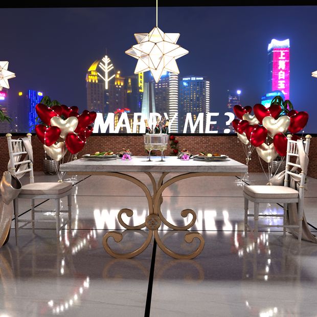 two white chairs and a table with flowers on it in front of a cityscape