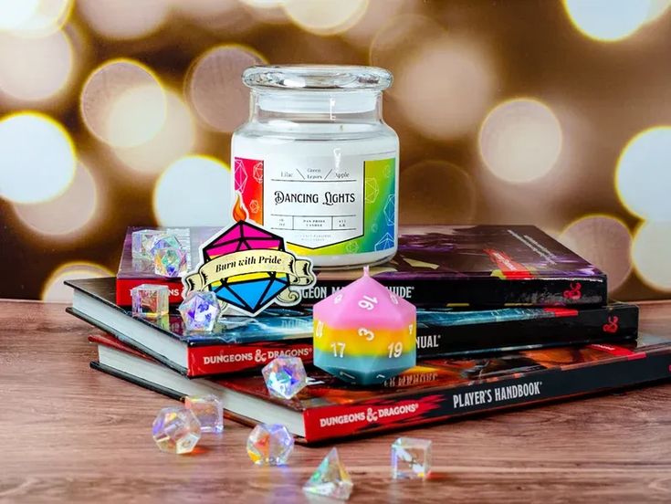 a candle and some books on a table