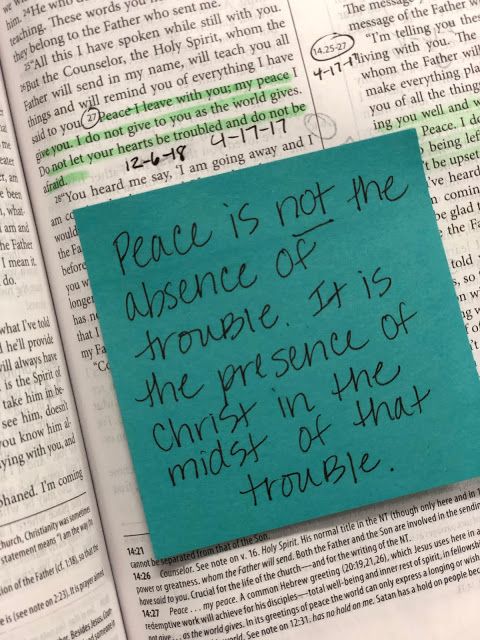 a piece of paper that has been placed on top of an open book with the words peace is not the distance of anyone else