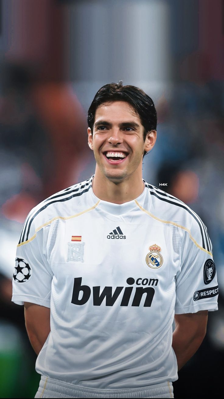 a soccer player is smiling for the camera