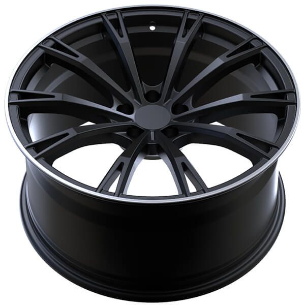 a black wheel on a white background with no other wheels in the photo to describe