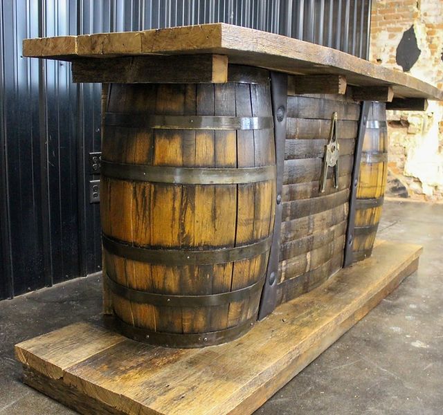 an old wooden barrel sitting on top of a pallet