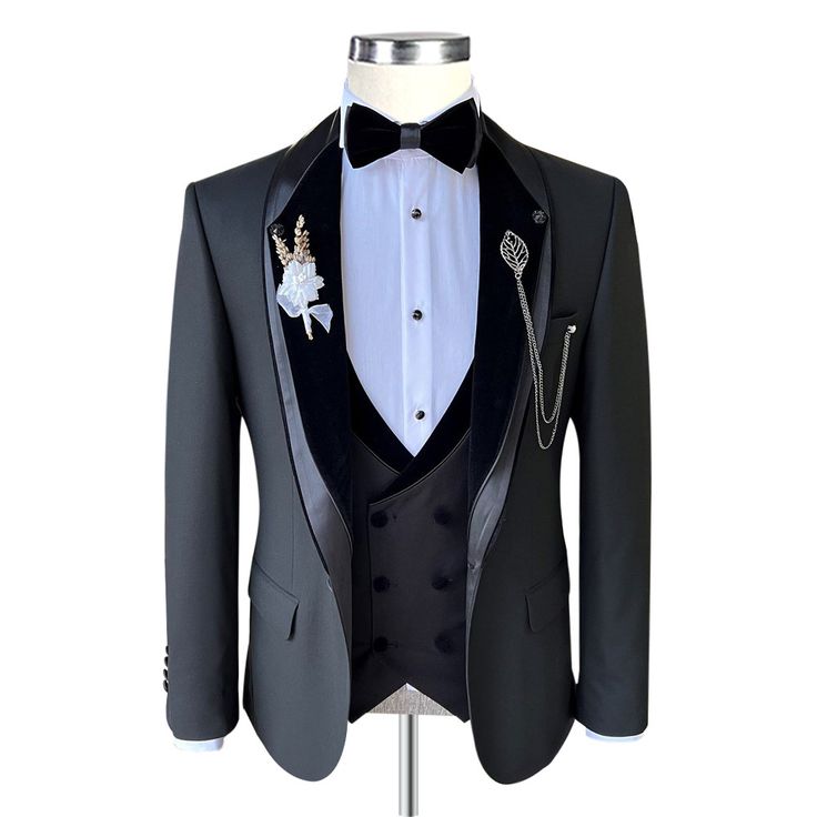 Package Includes: 1 x Jacket - 1 x Waistcoat - 1 x Pant

Step into timeless elegance with our grey tuxedo, crowned by a rich Black Velvet Lapel. This masterpiece, sculpted from premium 120s fabric and lined with silk, exudes sophistication in every stitch. The shawl lapel and double-breasted waistcoat offer a bold yet refined contrast, while the grey trousers, highlighted by a subtle velvet stripe, complete the look. Designed for those who dress to leave an impression, it’s the ultimate choice f Tuxedo Blazer For Black Tie Winter Events, Black Tie Winter Tuxedo Blazer, Winter Tuxedo Blazer For Black Tie Events, Winter Tuxedo Blazer For Black Tie, Winter Black Tie Tuxedo Blazer, Black Blazer For Black-tie Events In Winter, Elegant Winter Blazer For Black Tie Events, Black Tie Tuxedo Outerwear, Winter Black Tie Tuxedo With Notch Lapel