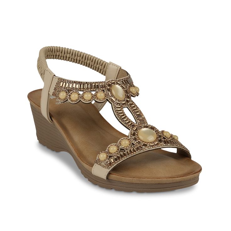 GC Shoes-Fiah Sandal Add some sparkle to your summer looks with the Fiah sandals from GC Shoes. This pair features a simple style that is embellished with sparkling rhinestones and gems. Featuring a strong wedge heel that adds support to your steps. Beaded Open Toe Synthetic Sandals, Beaded Synthetic Open Toe Sandals, Summer Beaded Synthetic Sandals, Elegant Beaded Summer Heels, Elegant Synthetic T-strap Sandals For Beach, Elegant Beaded Sandals For Summer, Elegant Beaded Synthetic Sandals, Elegant Embellished Sandals For Vacation, Stone Embellished Round Toe Sandals For Summer