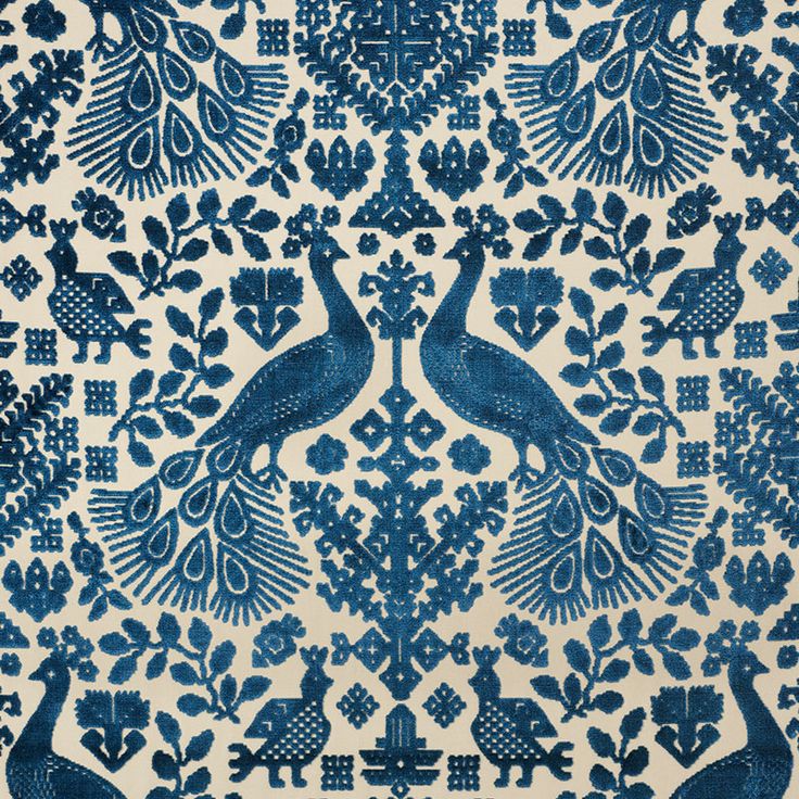 a blue and white wallpaper with two peacocks on it's back side