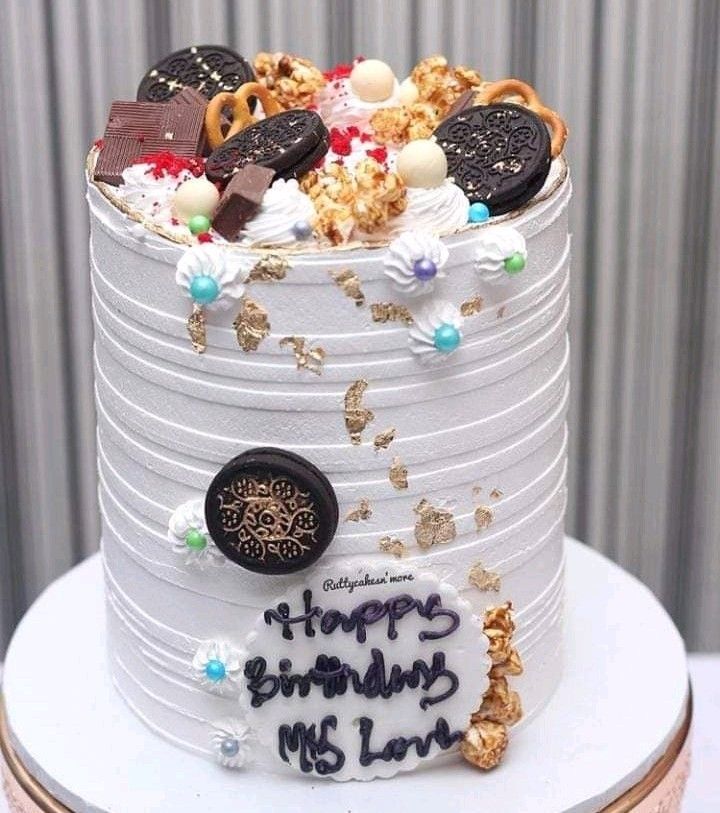 a birthday cake with cookies and candies on it that says happy birthday my lord