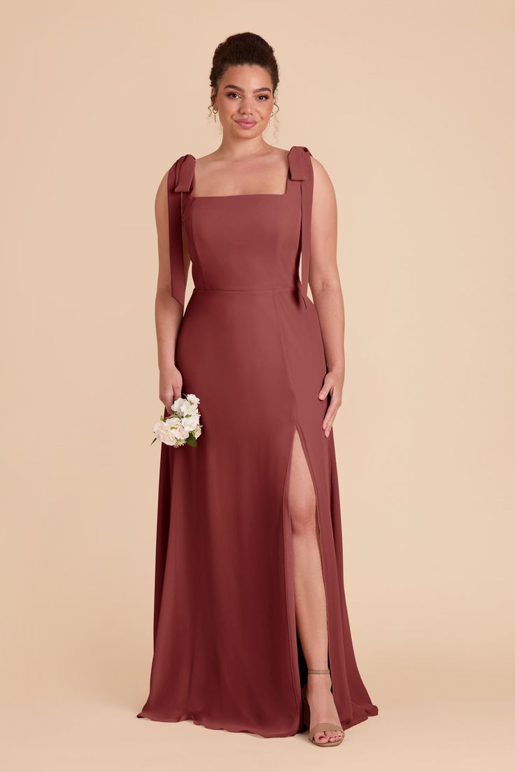 a bridesmaid in a long dress with one leg slited and the other side split