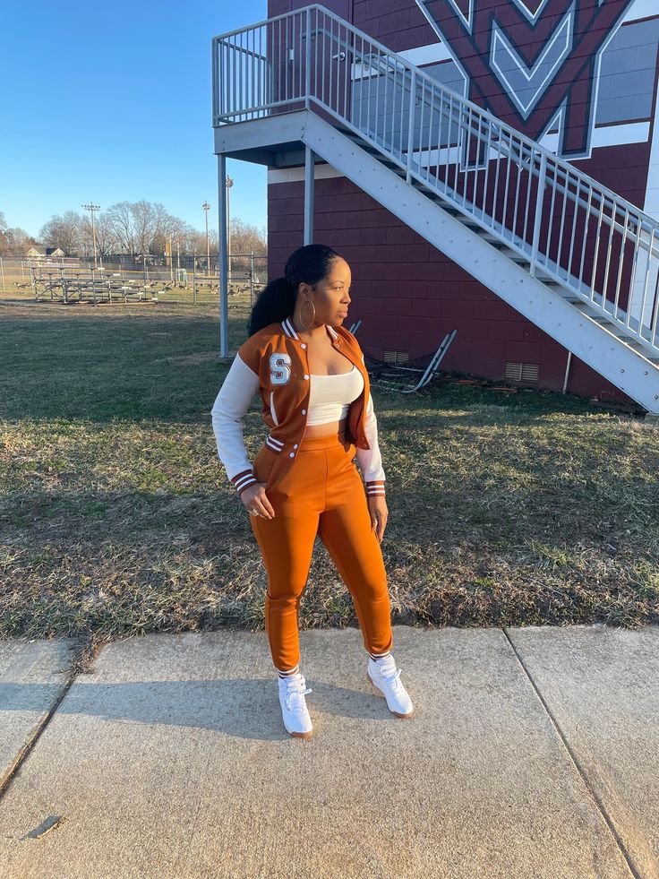 You would look so cool in our varsity set! The energy of this youthful tracksuit, makes you feel full of power and bats the annoyance away. Available in 4 colors for you to determine your own fashion style. Pair with a simple white top and you will be so chic. In sneakers or heels... you bad sis! Details: 95% Polyester; 5% Spandex Long sleeves jacket High waisted style joggers Great Stretch Comfortable Model is wearing a size medium Fits true to size for most Model Measurements: Size: Medium (8) High Waist Fashion, Simple White, Long Sleeves Jacket, Swag Outfits, The Energy, White Top, White Tops, Model Measurements, Make You Feel