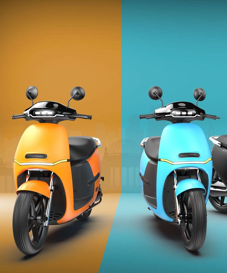 two different colored scooters side by side on a blue, yellow and orange background