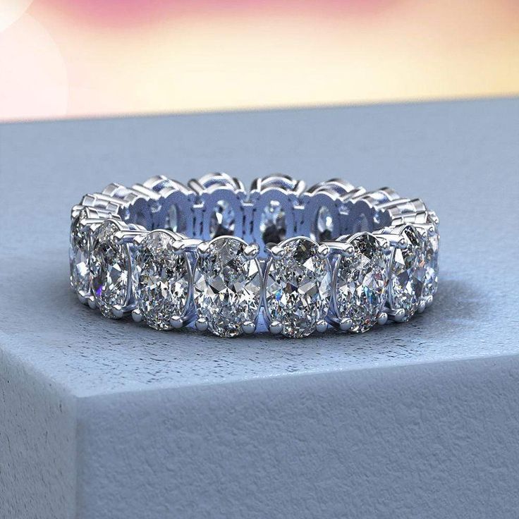 An exquisite reflection of your love, this fancy-shape diamond eternity band is certain to thrill for wedding or anniversary. Expertly crafted in sleek 14K White Gold, this remarkable design showcases sparkling 16 pieces 6x4 mm 6.5 Carat T.W. oval-cut CZ - each boosting a color rank of H and clarity of VS2 - that surround the endless band. Please remember that you can customize this ring in any way you would like in 3D. The exact number of diamonds and total carat weight will vary depending on t Princess Braids, Oval Eternity Band, Diamond Anniversary Bands, Oval Moissanite, Diamond Anniversary Rings, Diamond Anniversary, Brown Diamond, Jewelry Diamond, Platinum Ring