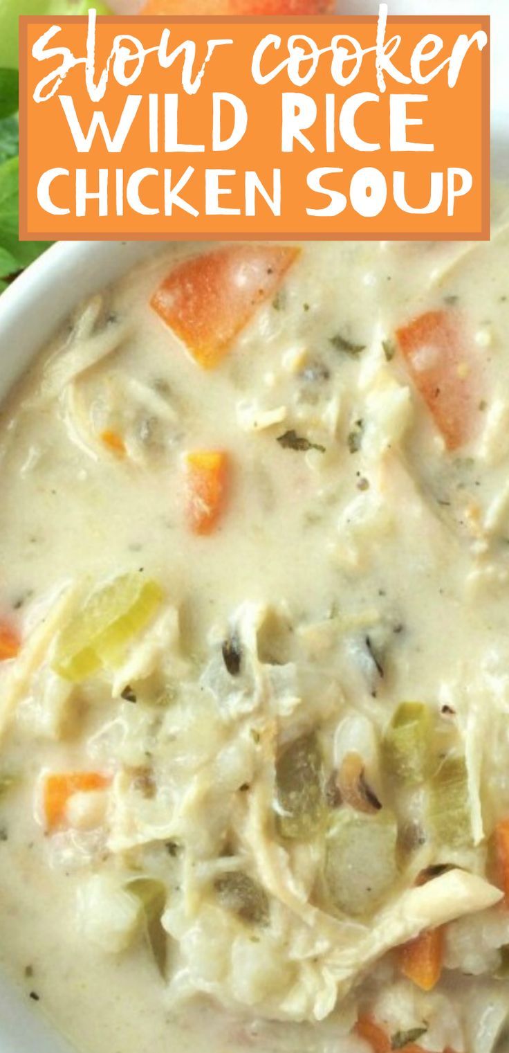 a bowl of slow cooker wild rice chicken soup with carrots and celery