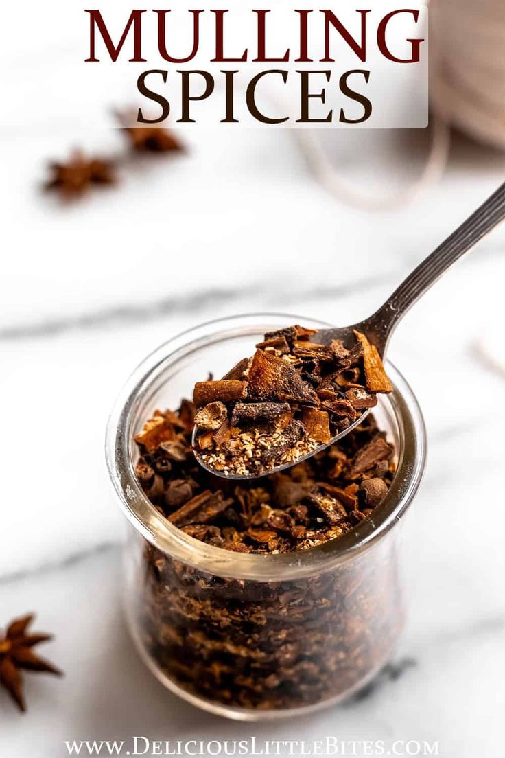 a glass jar filled with granola sitting on top of a table