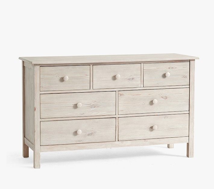 a white wooden dresser with six drawers