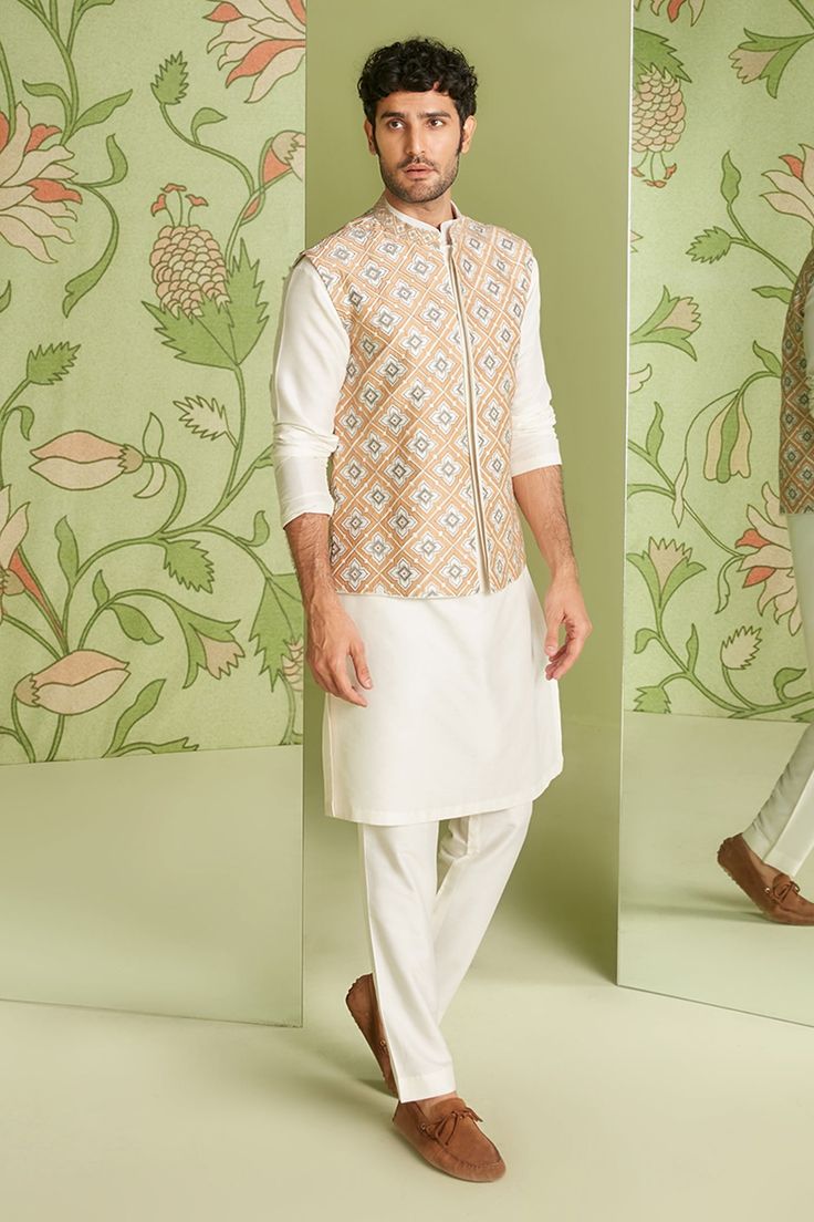 Ivory cotton silk embroidered bundi in applique and resham work. Paired with solid pant and kurta.
Component: 3
Pattern: Embroidered
Type Of Work: Applique work, Resham work
Neckline: Mandarin collar
Sleeve Type: Full sleeves
Fabric: Cotton silk
Color: White
Other Details: 
Embroidered placket kurta
Occasion: Reception - Aza Fashions Jatin Malik, Kurta And Pants, Length Check, Kurta Set For Men, Resham Work, Rohit Bal, Geometric Embroidery, Mens Ethnic Wear, Tarun Tahiliani