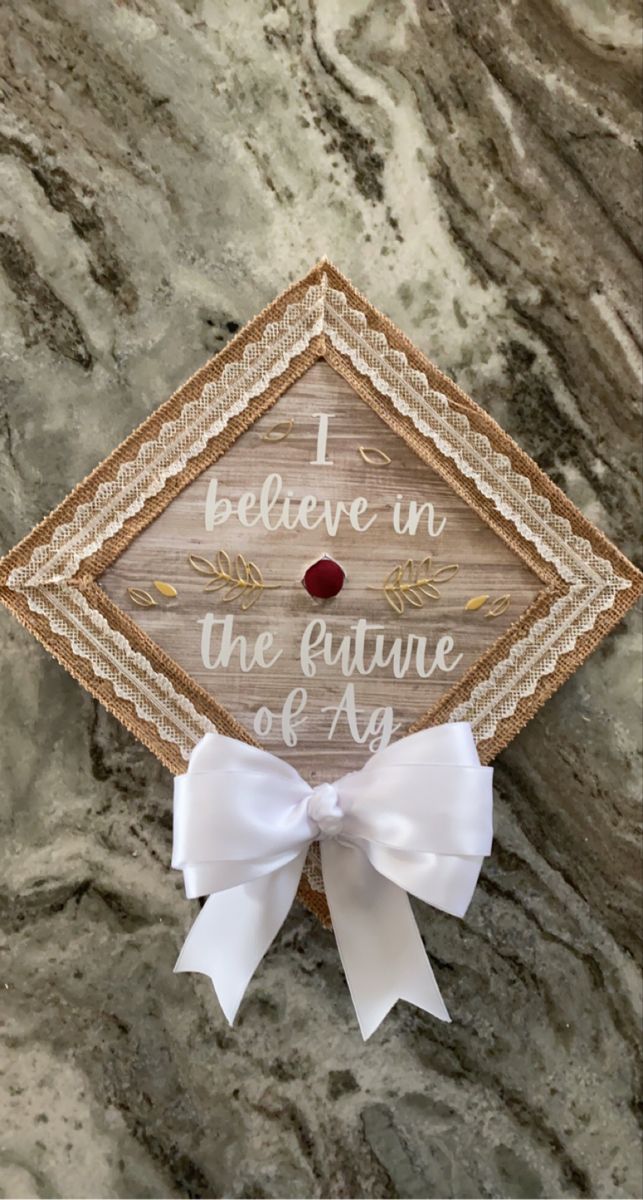 a graduation cap with the words i believe in the future of an arrow on it