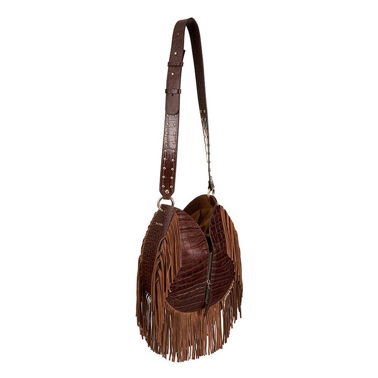 TARA FOLKS' 'Katherine' shoulder bag is instantly recognizable by the brand's signature Bohemian-inspired overlong fringing that swishes elegantly as you walk. Style it a few different ways - carry it by the braided top handle or switch that out for the gold brass stud elaborated strap to wear it cross-body.