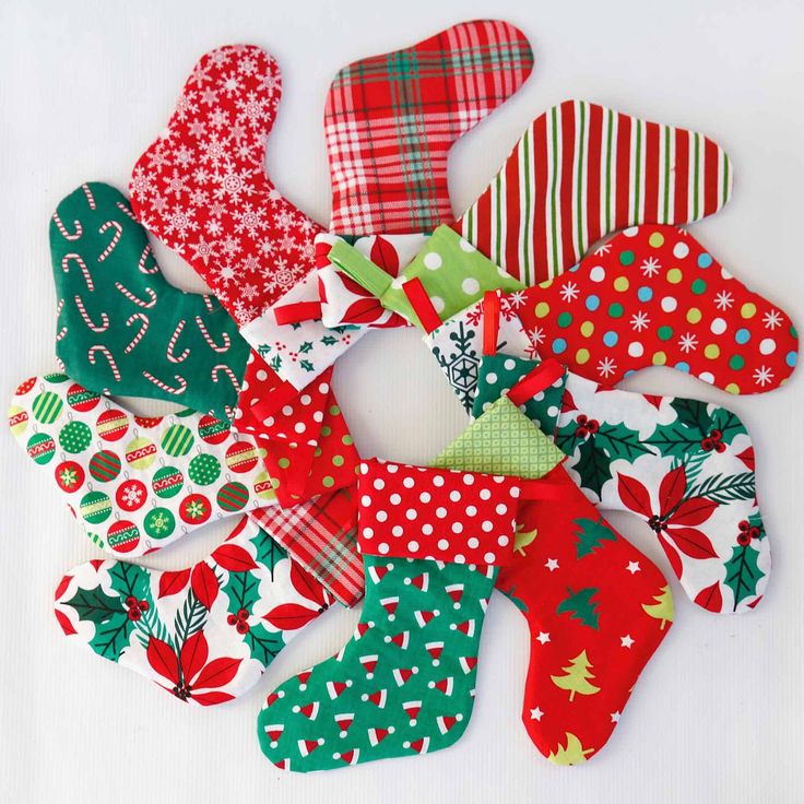 a pile of christmas stocking sitting on top of a white table