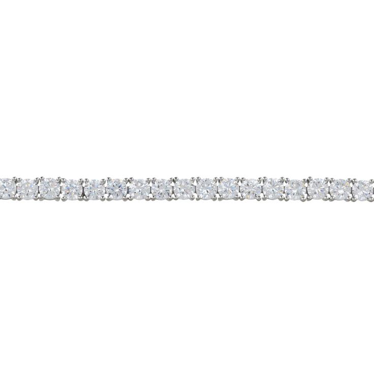 Illuminate your look with our Simulated Diamond Tennis Bracelet in Silver. This exquisite bracelet features simulated diamonds that sparkle brilliantly along its entire length. Each stone is meticulously set to maximize its shine, offering an elegant touch to any outfit. The bracelet is equipped with a secure tongue and box fastening, ensuring it stays in place with ease.   The bracelet effortlessly blends sophistication and comfort. Perfect for both everyday wear and special occasions, it's the Classic White Gold Bracelet With Sparkling Stones, Classic White Gold Bracelets With Sparkling Stones, Classic White Diamond Bracelet With Sparkling Stones, White Tennis Bracelet With Sparkling Stones, Classic White Bracelets With Sparkling Stones, Classic White Bracelet With Sparkling Stones, Dazzling Diamond Tennis Bracelet With Sparkling Stones, Classic Diamond White Bracelets With Sparkling Stones, Classic Diamond White Bracelet With Sparkling Stones