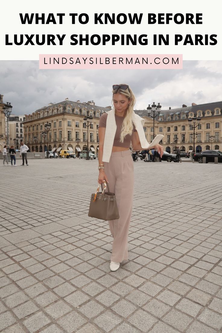 a woman walking in front of a building with the words what to know before luxury shopping in paris