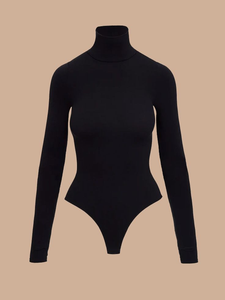 BOIndulge in the unparalleled elegance and comfort of the Classic Long Sleeve Turtleneck Bodysuit. Whether you're pairing it with a chic skirt for a sophisticated look or your favorite jeans for a casual yet refined ensemble, this versatile piece is your go-to wardrobe essential. Luxury Fabric:Crafted from a luxurious, high-stretch microfiber blend, this bodysuit offers a smooth, second-skin fit that moves with you. The fabric is machine washable, allowing for effortless maintenance and long-lasting wear. Advanced Craftsmanship:Designed with seamless construction, this bodysuit ensures a flawless, streamlined look. The high stretch and recovery of the fabric provide maximum comfort and flexibility, while superior body contouring enhances your natural silhouette. Universal Fit:The innovativ Kimono Pajamas, Chic Skirt, Turtleneck Bodysuit, Chic Skirts, Luxury Fabric, Lingerie Dress, Long Sleeve Turtleneck, Body Contouring, Women Supporting Women