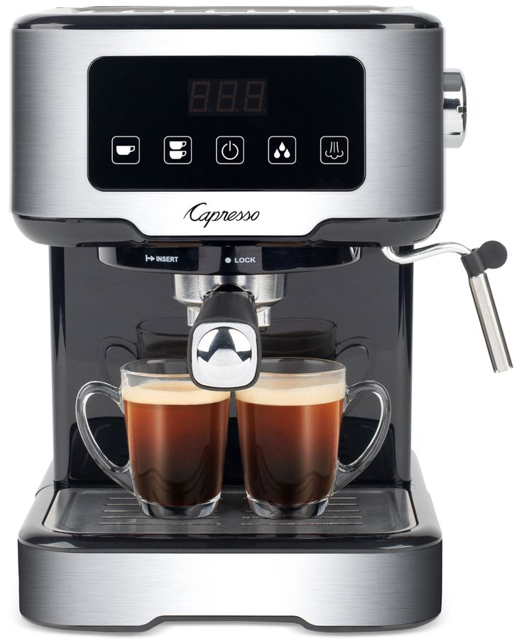 an espresso machine with two cups of coffee