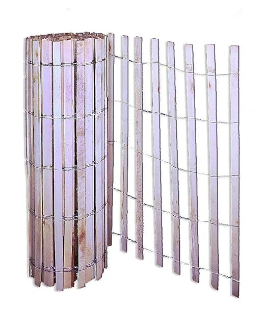 a tall metal fence is next to a white wall with bars on it and the top section has been stripped off