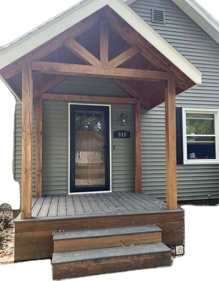 a porch with steps leading to the front door