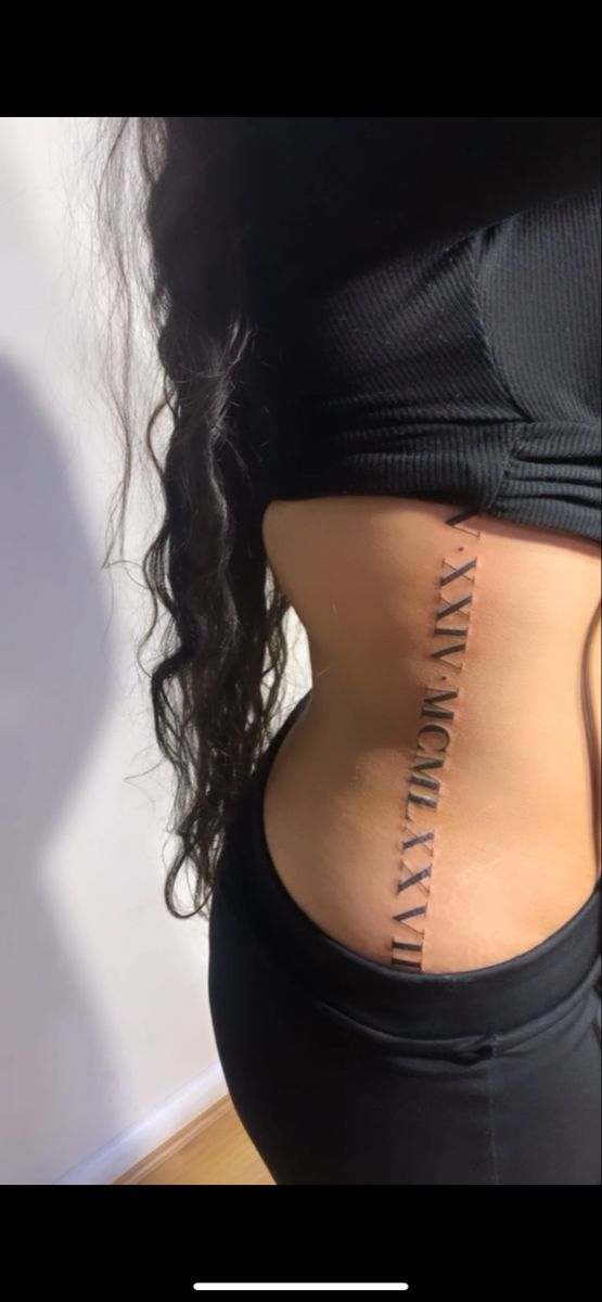 the back of a woman's stomach with an inscription on it that says, i am