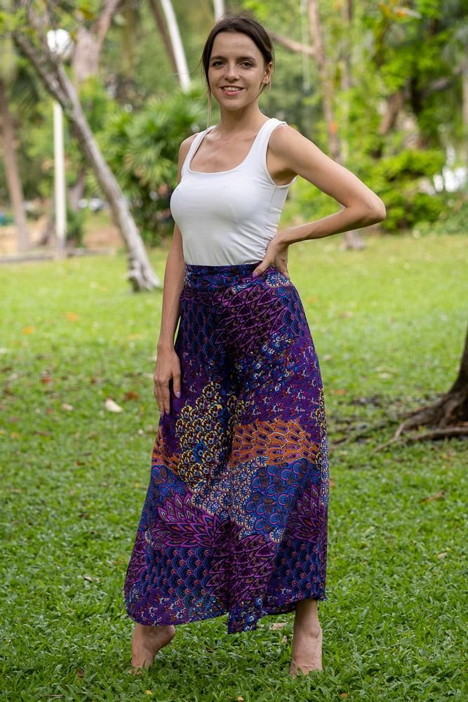 Breezy, comfortable and super easy to combine with your favorite tops.  What's not to love about these Thai Palazzo Pants? The fabric is printed with a mesmerising layered floral pattern which shimmer as the pants move. High-waisted and wide-legged they will suit most figures and are made to be worn as full length pants.  To make these pants more comfortable, elastic has been used on the rear of the waistband, giving you the chance to show off the top of the pants without the smoc Hippie Cotton Bottoms With Floral Print, Multicolor Floral Print Rayon Bottoms, Printed Wide-leg Rayon Bottoms, Bohemian Rayon Pants With Floral Print, Printed Rayon Wide-leg Pants, Printed Rayon Long Pants, Multicolor Floral Print Hippie Bottoms, Bohemian Cotton Pants With Floral Print, Hippie Multicolor Floral Print Bottoms