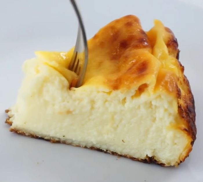 a piece of cheesecake with a fork in it