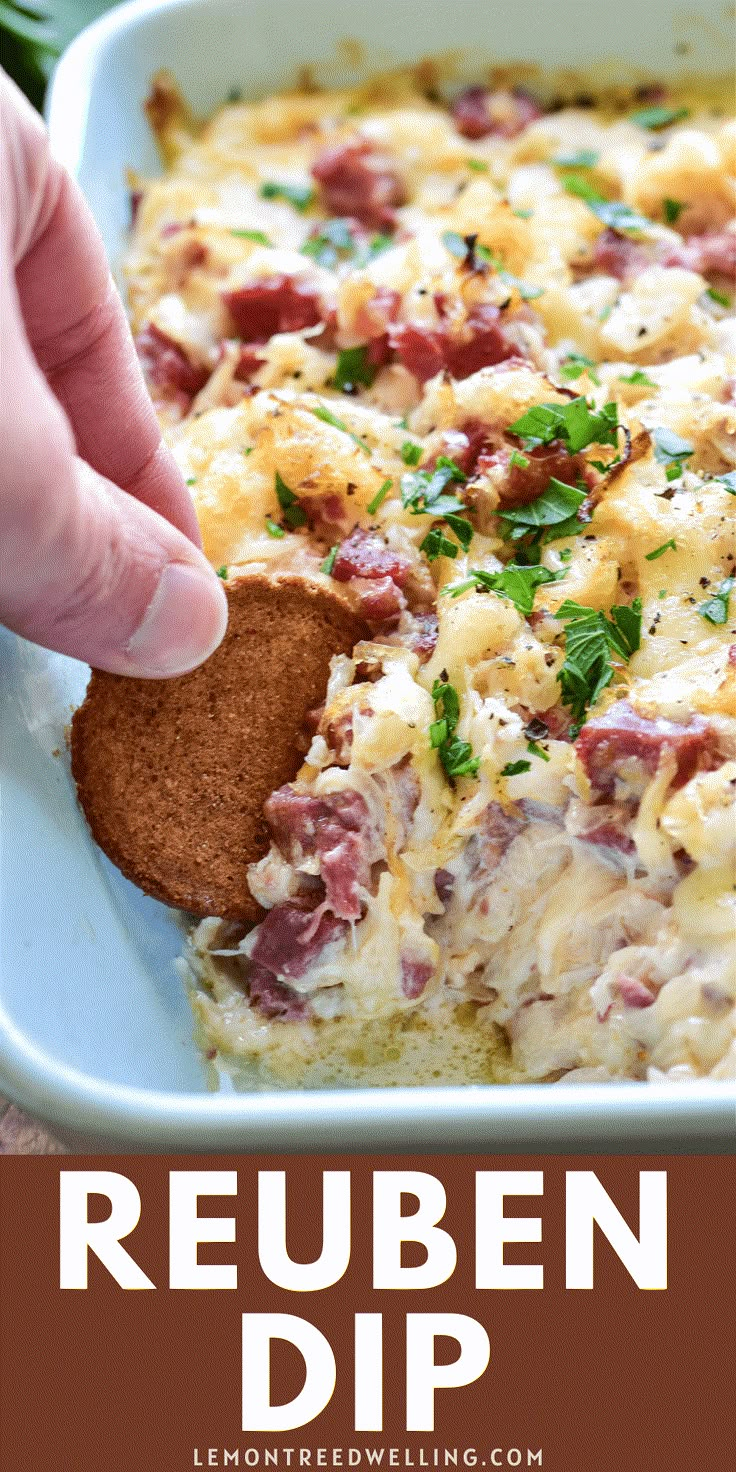 a person dipping bread into a casserole dish with the words reuben dip on it