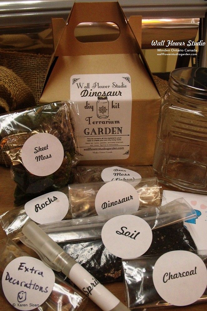 an assortment of spices and condiments in a box on a table with labels